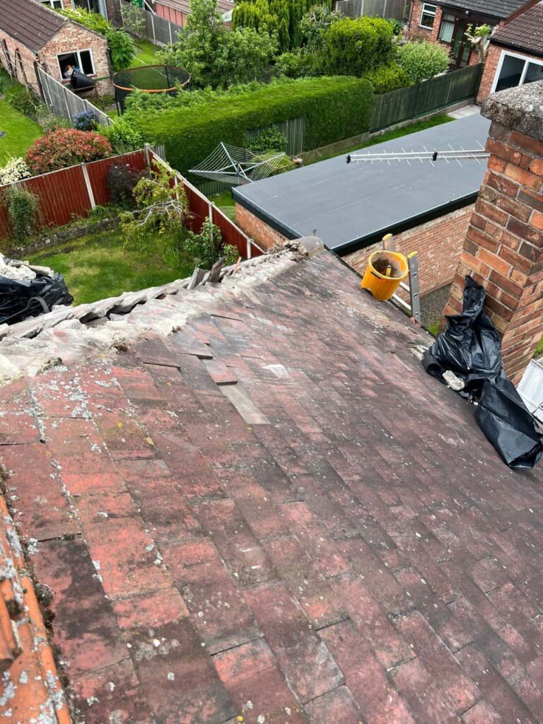 This is a photo of a roof where the hip tiles have been removed, and are just about to be replaced. Works carried out by Ripley Roofing Repairs